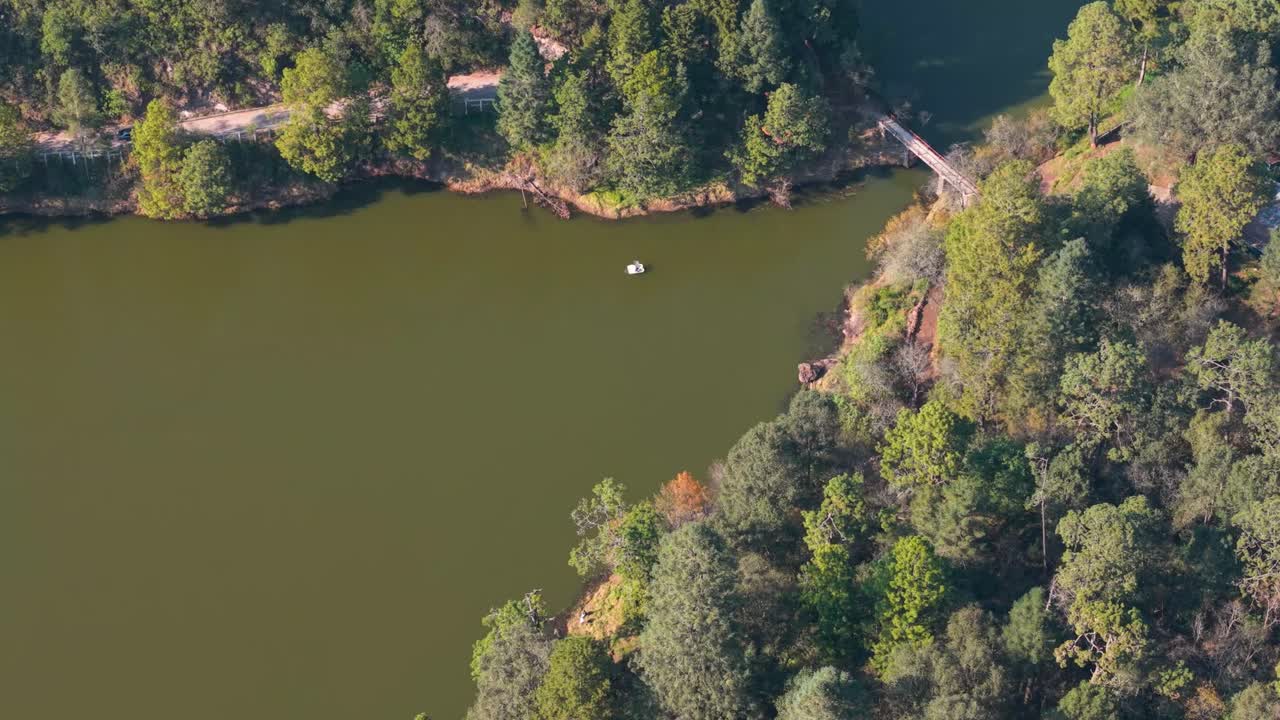 Drone look at the Zempoala Lakes nestled among mountain forests