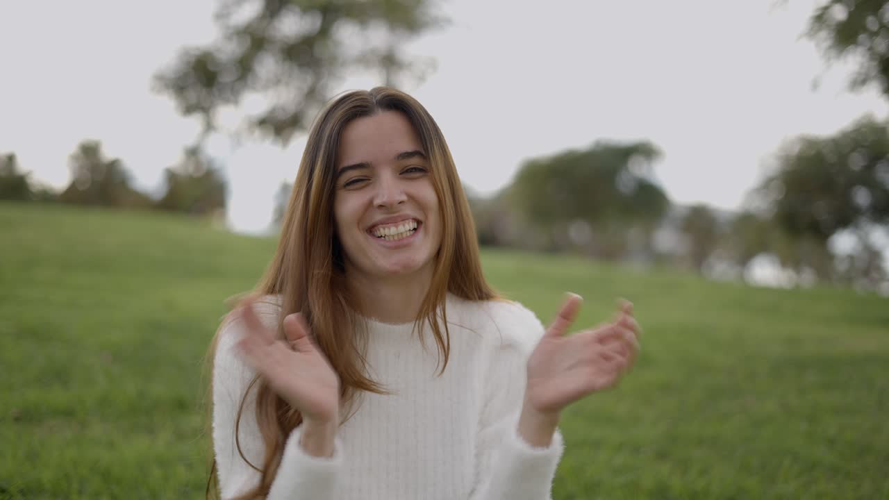 Happy Woman Clapping Outdoors