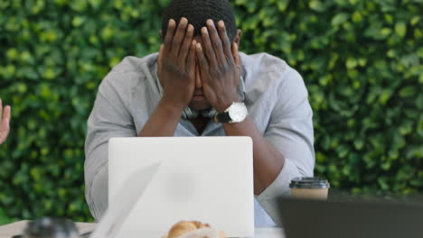 bored african american businessman in office meeting expressing disinterest lazy employee looking irritated student man boring presentation lecture