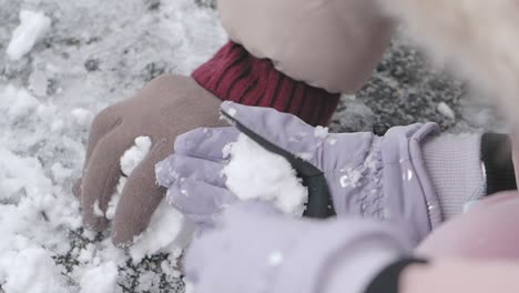 kids making snowballs