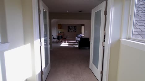 stabilized shot of hallway inside luxury home.