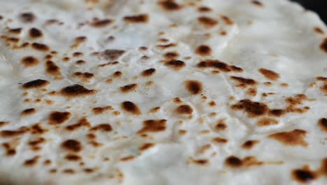 close-up view of a cooking flatbread