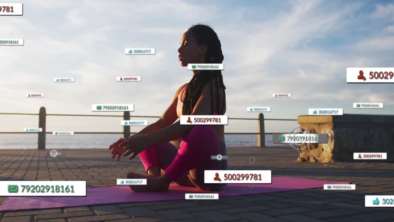 Sitting woman in leggings stretching for yoga on pink mat by ocean, labels appearing