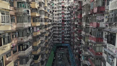 aerial of an old apartment complex called yick fat on quarry bay, hong kong, china