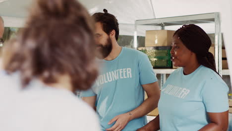 female volunteer assists elderly man