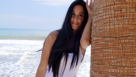 Lady-Leaning-her-Head-Against-Beach-Palm-Tree