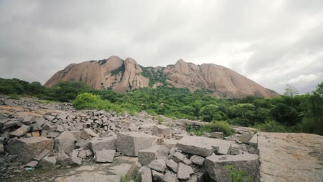 wide shot showing rocky mountain in kerala state during cloudy day. beautiful landscape with mangroves trees in background. kerala,india.