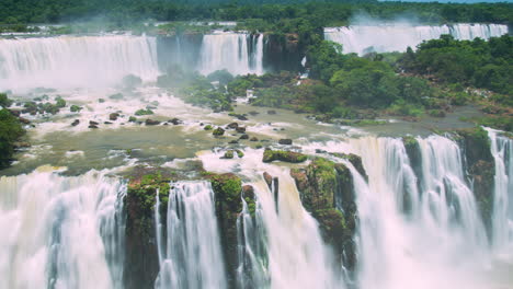 Timelapse-of-Waterfalls-of-Iguazu-around-a-big-green-area,-in-a-sunny-day,-Foz-do-Iguacu,-Parana,-Brazil