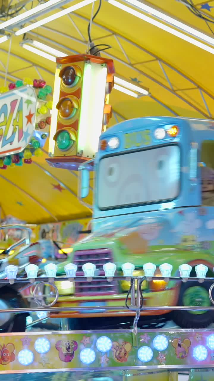 A vibrant and colorful carnival ride in motion with decorative lights