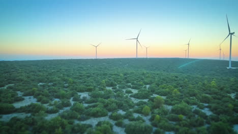 Mechanical-engineer-adjusting-wind-turbine-settings-from-his-laptop---CGI-render