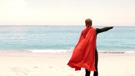 man in wet suit dressed as superman