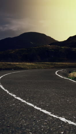 a winding road leading through a mountain pass