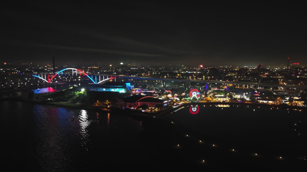 Panoramic drone shot around the illuminated Hoan park, fireworks in Milwaukee