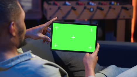 african american male freelancer holding phone with mockup copy space screen