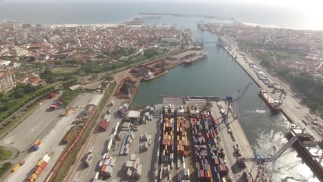 aerial view of port with containers and container ship