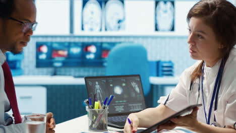 medical expert discusses test results with a patient in a healthcare setting