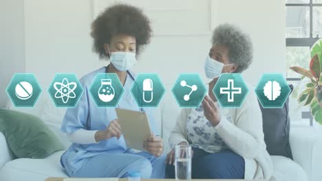 animación de iconos médicos sobre una doctora afroamericana con un paciente