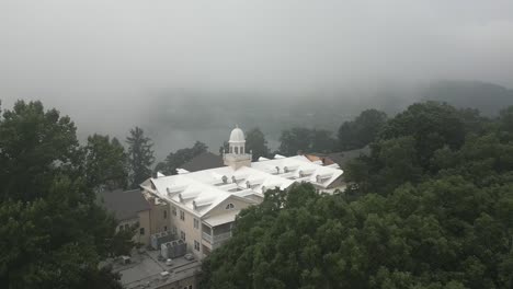 Historic-Lambuth-Inn-aerial-flyover-on-foggy-Lake-Junaluska-shore