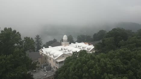 historic lambuth inn aerial flyover on foggy lake junaluska shore