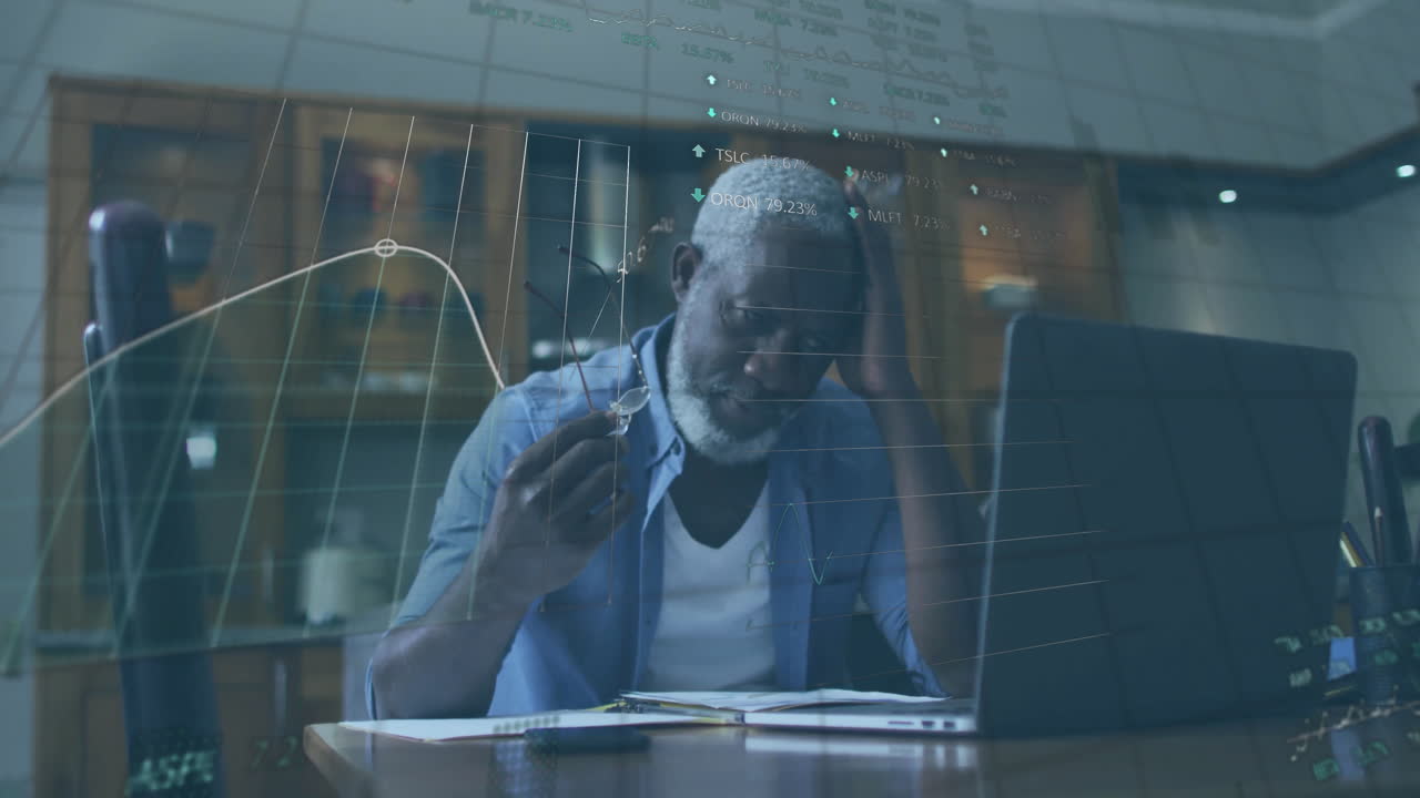 Animation of financial data processing over senior african american man using laptop