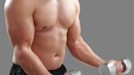 serious muscular man lifting dumbbells