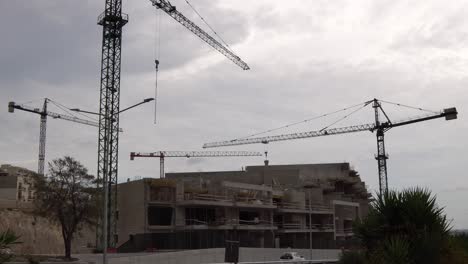 video from malta about a construction in a windy cloudy day