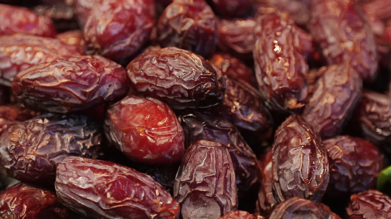 A closeup image of rich, brown dried dates, perfect for healthy snacking and various culinary uses