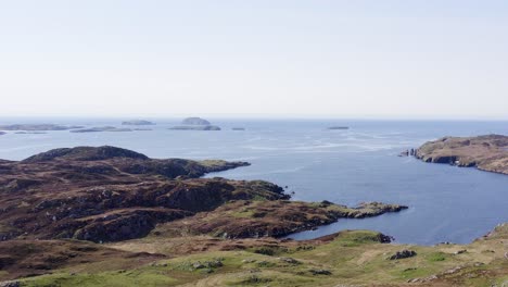 Ascending-drone-shot-of-the-cliffs-around-the-district-of-Carloway-on-the-Isle-of-Lewis,-part-of-the-Outer-Hebrides-of-Scotland