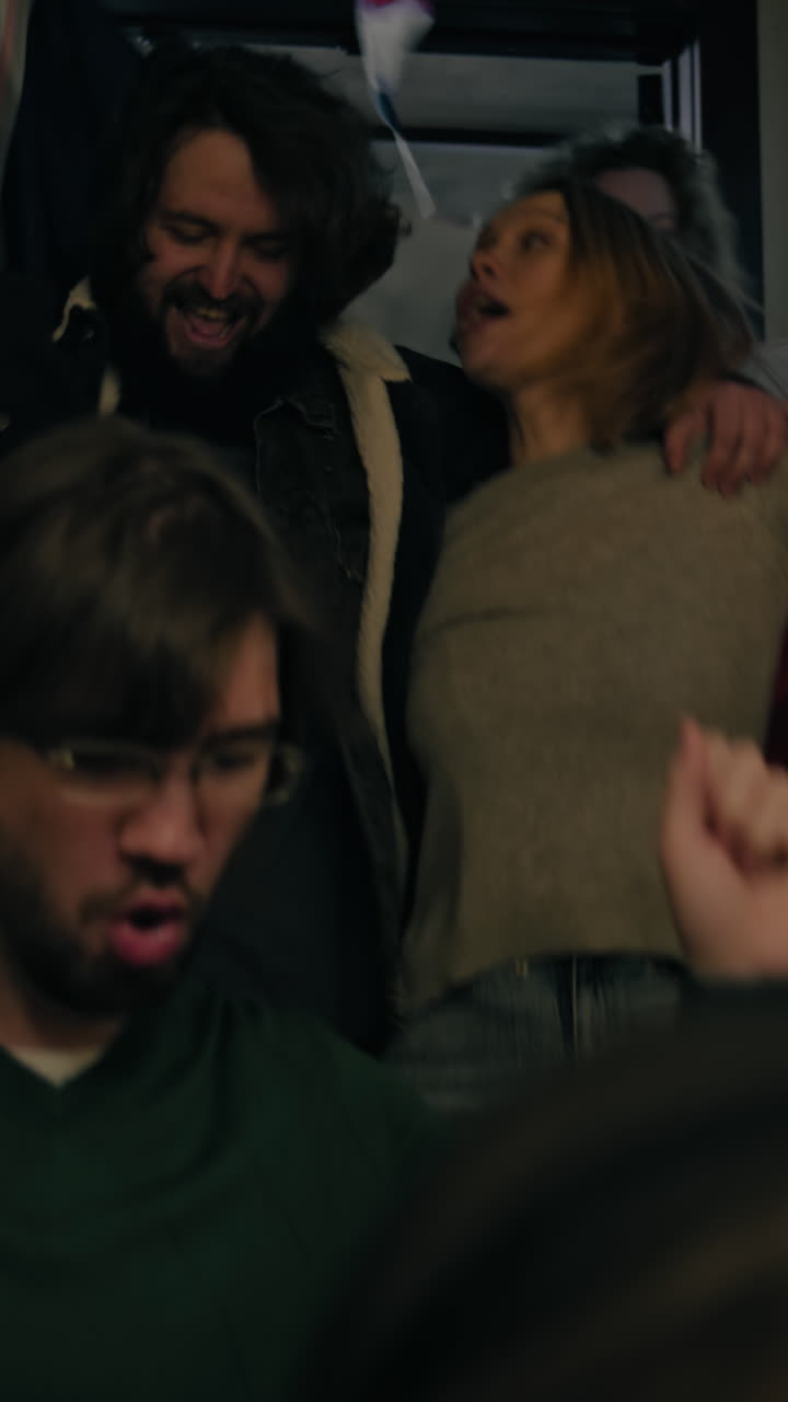 People Celebrating in Public Transport