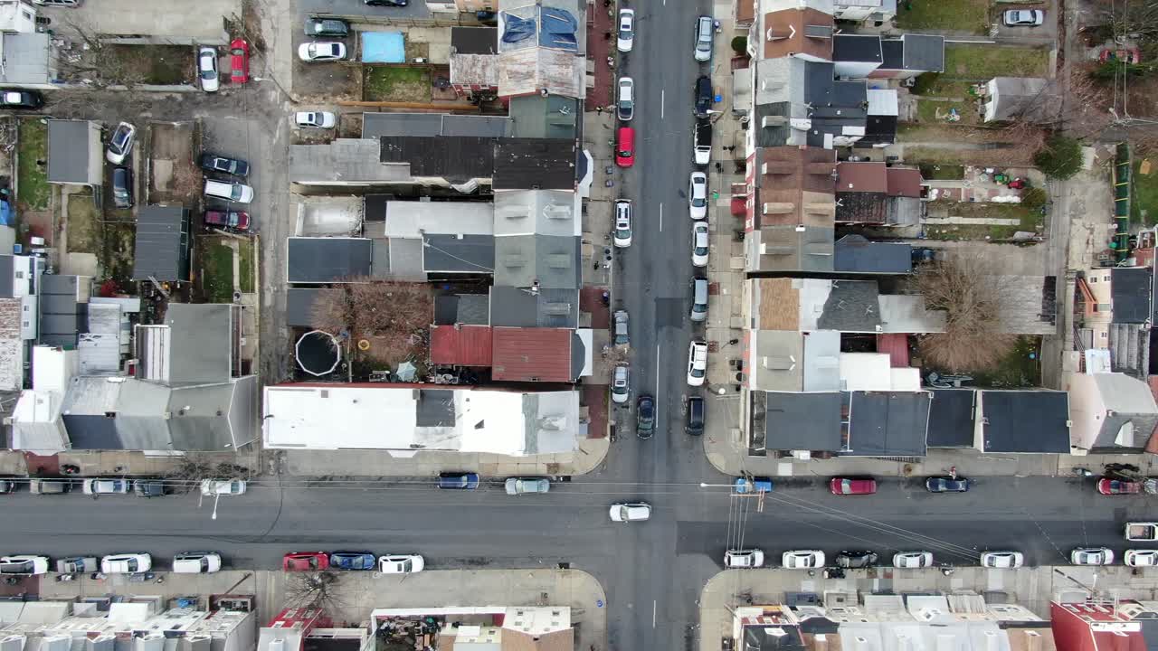 Urban city housing projects in USA, top down aerial drone shot, illegal immigration, poverty, racial diversity in crime ridden community