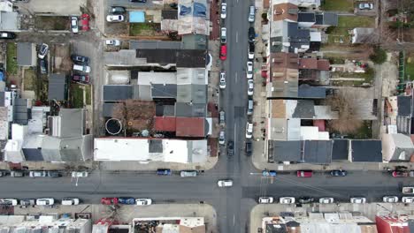 urban city housing projects in usa, top down aerial drone shot, illegal immigration, poverty, racial diversity in crime ridden community