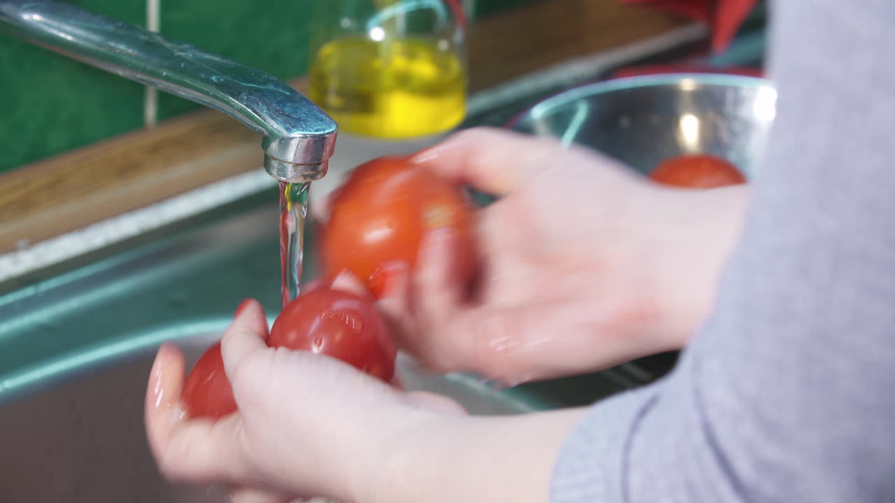 Washing Garden Tomatoes in Sink