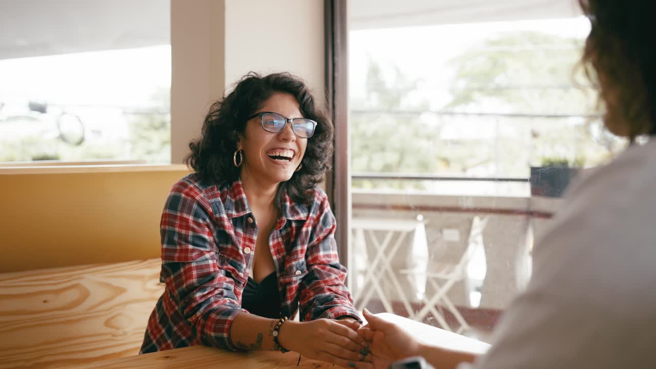 Two women having a conversation at a table