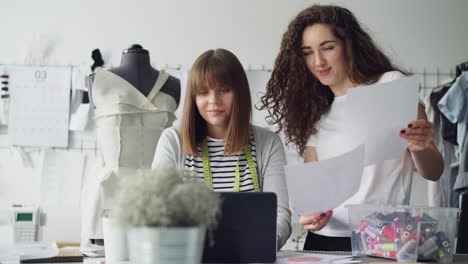 two fashion designers collaborating in a design studio