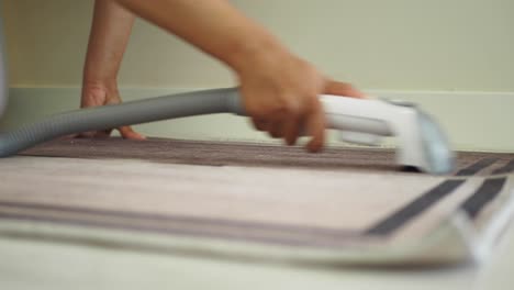 cleaning a carpet with a vacuum cleaner