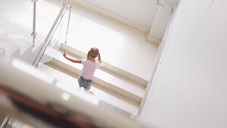 Video-of-top-view-of-diverse-girls-walking-upstairs-at-school