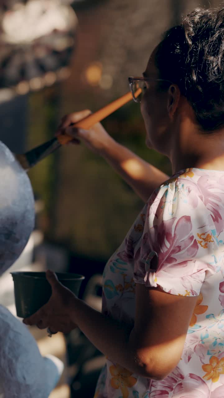 A woman painting an art project