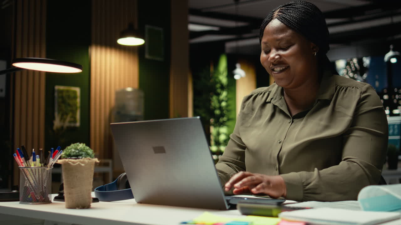 African american analyst reading emails and managing administrative tasks