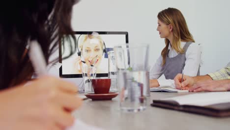 Business-executives-discussing-while-having-video-call-on-computer-4k