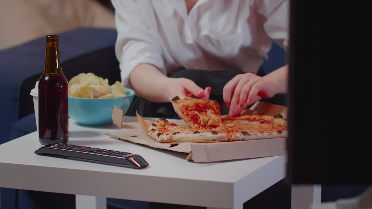 Close up of white table with unhealthy food and beer