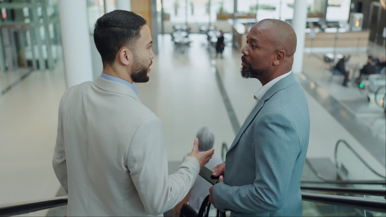 Escalator, handshake and business men