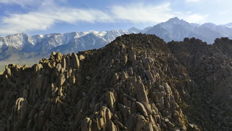 Drone-tilting-over-rocky-hills,-sunny-day-in-California,-United-states-of-America