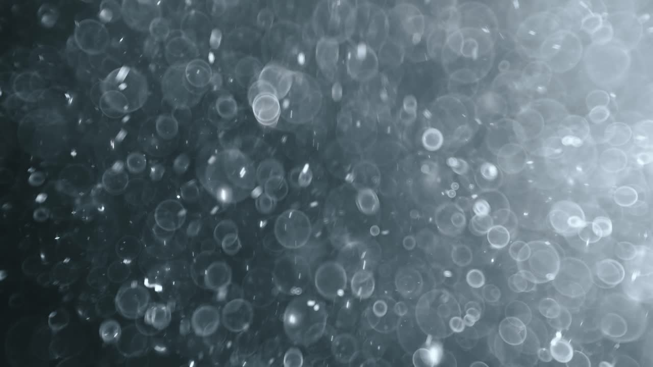 bokeh de partículas abstractas flotantes sobre fondo oscuro