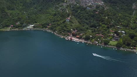 aerial: boat in atitlán lake in guatemala