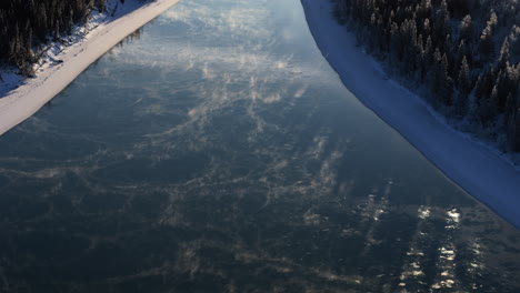 reflections over lake laberge in yukon river, north of whitehorse, yukon canada. aerial shot