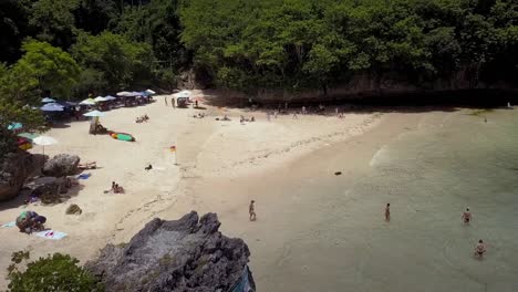 AERIAL-DOLLY-FORWARD-VIEW-of-PADANG-PADANG-BEACH-,-is-one-of-Bali’s-most-famous-spots