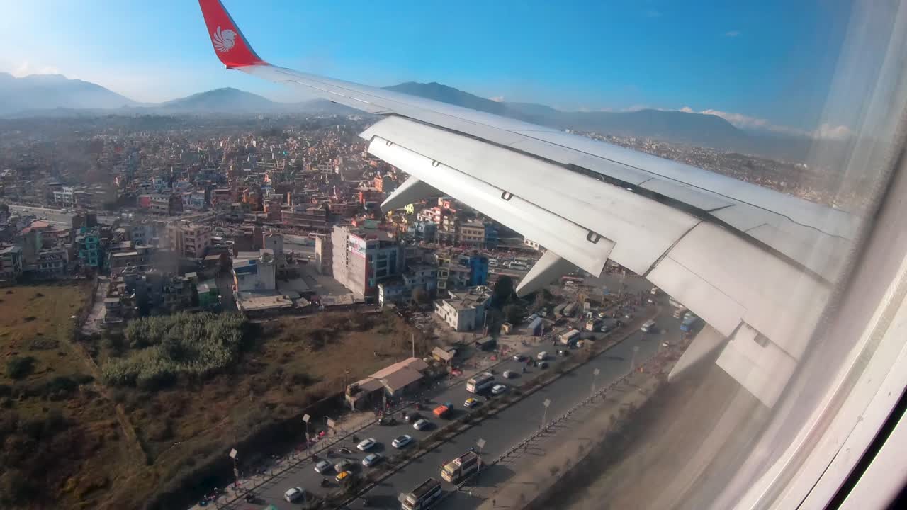 Window view of airplane landing at Kathmandu