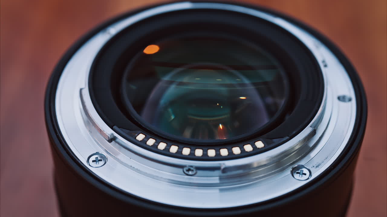 Close up of a camera lens on a wooden table