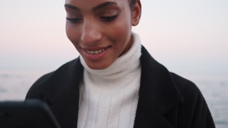 african american girl using mobile phone.