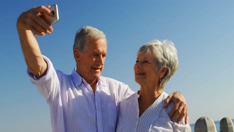 Senior-couple-taking-selfies-at-promenade-4k